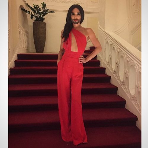 August 10, 2015Conchita at the opening concert of the 5th Prague Pride in a red silk jumpsuit from C