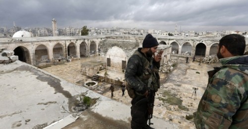 SAA soldiers on the roof of the Ma'arrat al-Nu'man’s archaeological museum.&gt; Photo: Louai Beshara