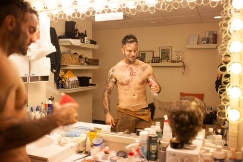 Ramin Karimloo sprays himself down before the first scene of the show. Photo by maxgordonphotography