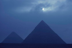 grandegyptianmuseum: Full moon over the pyramids of Giza at night 