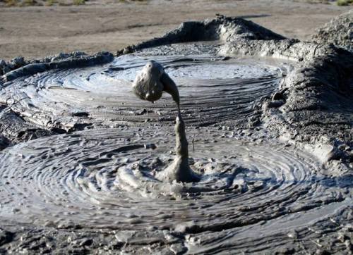 Mud volcano erupting in AzerbaijanHere a photographer has caught a mud volcano literally in the act;
