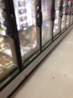 sixpenceee:toaderload: For sixpenceee, I tried to take a selfie while grocery shopping and I accidentally took this picture of the freezers at walmart and forgot to delete it when I got home and looked through the pictures, I noticed something strange