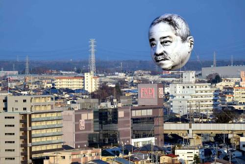 shihlun: A giant helium balloon bearing the face of an ojisan (middle-aged man) appeared in the sky 