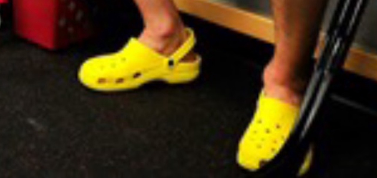 yellow crocs on feet