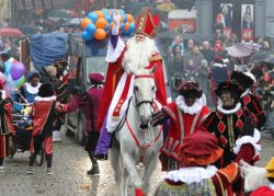 zumainthyfuture:  hazeleyed1:  divinityomega:  I want to tell you about Sinterklaas and his helpers Black Pete. A tradition in the Netherlands, a holiday for the children. I’m gonna try to keep it short and simple. On December 5th in the Netherlands,