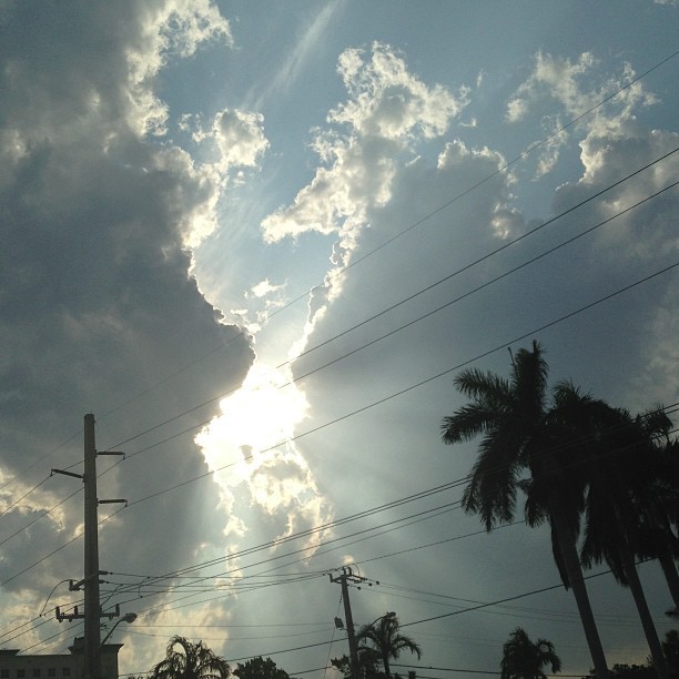 2 beautiful clouds closing in on the sun â˜º #pretty #sunset #miami #sun #clouds