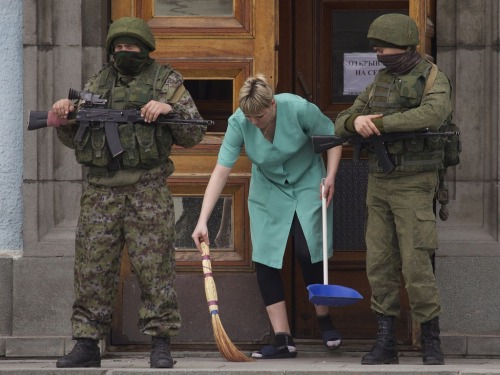 gunrunnerhell:  The Russians Heavily-armed soldiers without identifying insignia guard the Crimean parliament building after taking up positions there earlier in the day on March 1, 2014 in Simferopol, Ukraine. The soldiers’ arrival comes the day after