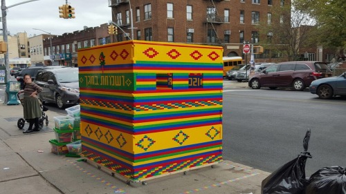 happiness-in-yiddish: Amazing sukkah made out of Lego in boro park in front of a toy store.