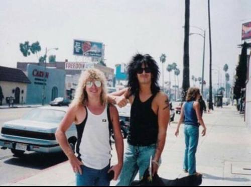 Steven Adler and Nikki Sixx standing in front of the Sunset Guitar Center, late ‘80s.