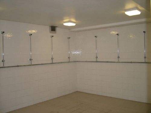 The men’s shower room at Roundhegians Rugby Club, Leeds, UK