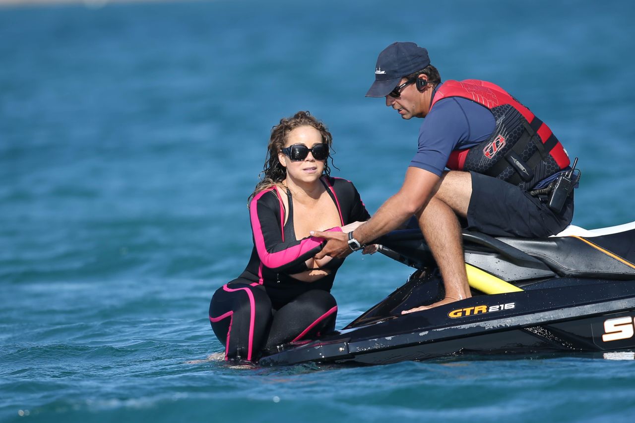 blackfemalecelebrities:    Mariah Carey - Wearing a wetsuit in Italy - 06/21-2015
