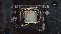zerostatereflex:  Zoom Into a Microchip It is absolutely crazy how tiny we can make things today. What we’re seeing here is a standard microchip, older though in principle the same as modern cell phone chip. At the micro level we’re dealing with this