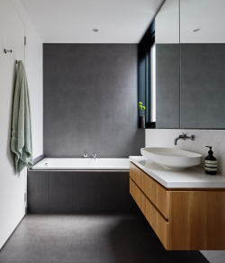 remodelproj:Nice grey floor to wall tile contrasting wood cabinet in bathroom