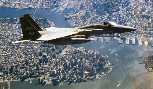 nocternalrandomness:  CAP over NYC An F-15A Eagle from 102nd Fighter Wing, Massachusetts Air National  Guard, flies a Combat Air Patrol over New York City as part of Operation  Noble Eagle. F-15s from the 102nd were the first to arrive on scene  over