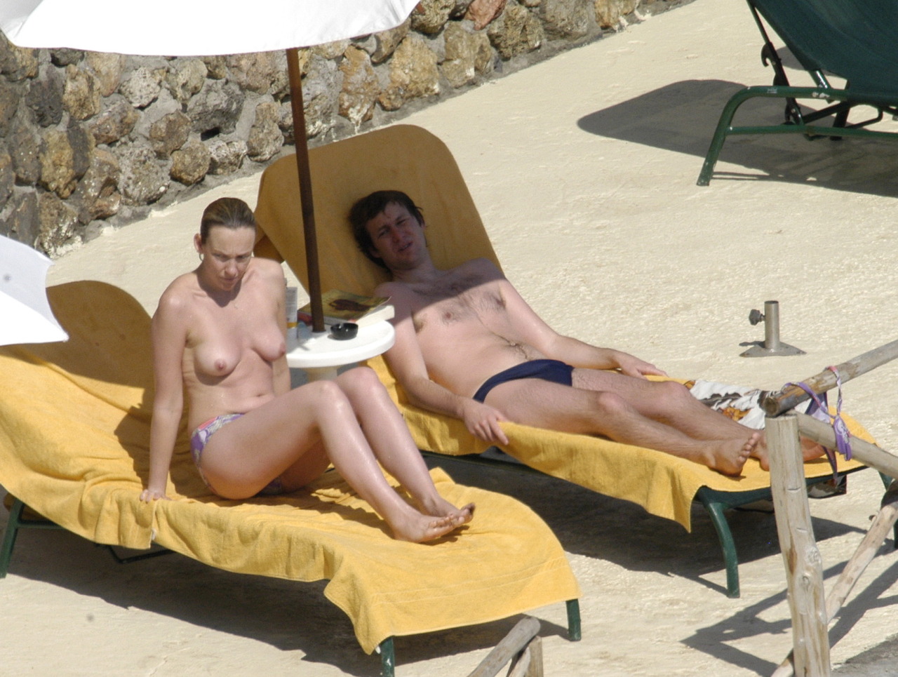 toplessbeachcelebs:  Toni Collette (Actress) sunbathing topless in Italy (December