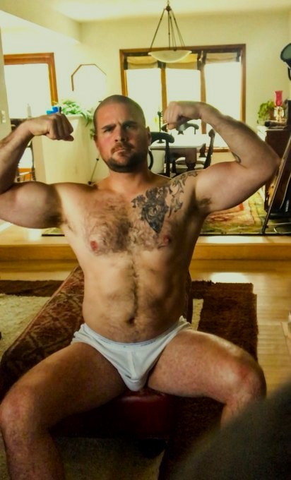 Flexing His Muscles In Jockeys Y-fronts