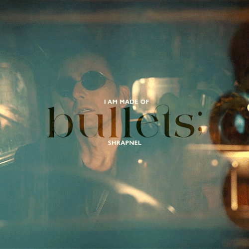 Gif 1/7: Two semi-transparent layers, one with an orange and one with a cyan undertone. First: Crowley in his Bentley, taking off his sunglasses, looking exhausted. Second: A close-up of the bullet leaving the gun during the 1941 magic trick. In the middle, it says: "I am made of bullets; shrapnel"