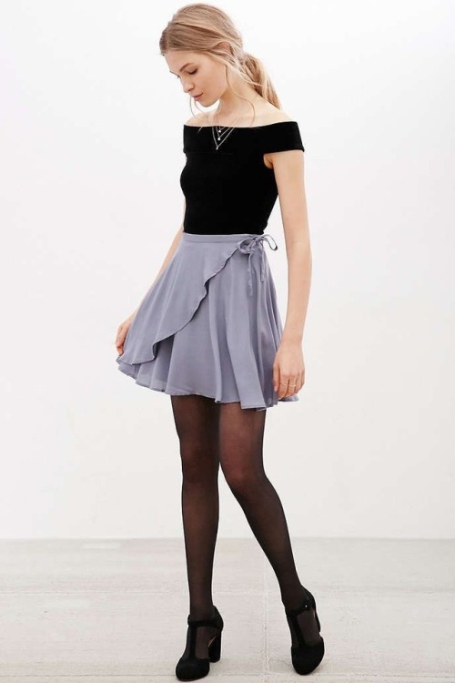 Grey skirt with black top and tights