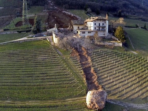 the-gas-station:  Rolling Stones Picture: Last Tuesday, a landslide in Northern Italy produced two huge boulders that barely missed a farmhouse and destroyed a nearby barn as they plowed their way downhill. © Tareom, Source 