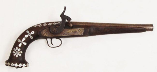 An Afghan decorated percussion pistol with pearl and gold inlays, late 19th century.