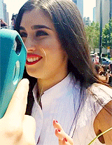 5harmonism:  Lauren climbing on a wall to greet fans and take pictures with them