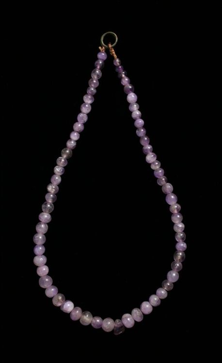 Amethyst Bead NecklaceThis necklace is composed of sixty-four polished amethyst spherical beads, the