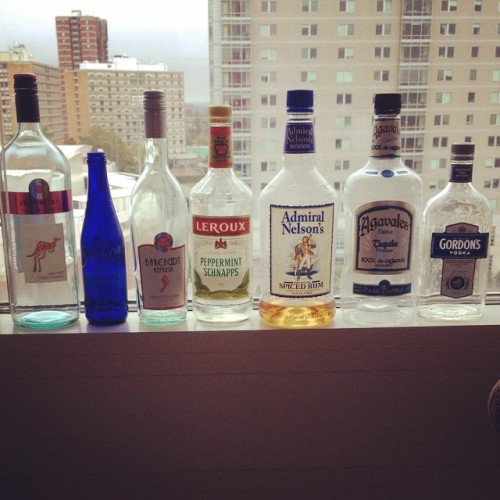 imthehomoyourmomwarnedyouabout:  So my roommates decided to start making an alcohol window … The only thing on here that wasn’t solely consumed by me is that lil blue bottle … And it was water. They need to step their game up 💪