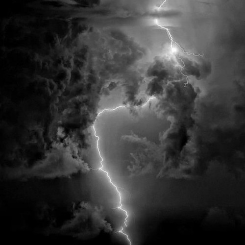 untamedstreet:lightening bolt in black clouds, by steve maguire.