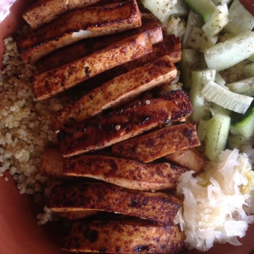 Tonight&rsquo;s dinner! Smoky tofu over quinoa with cucumbers and sauerkraut. Simple and delicio