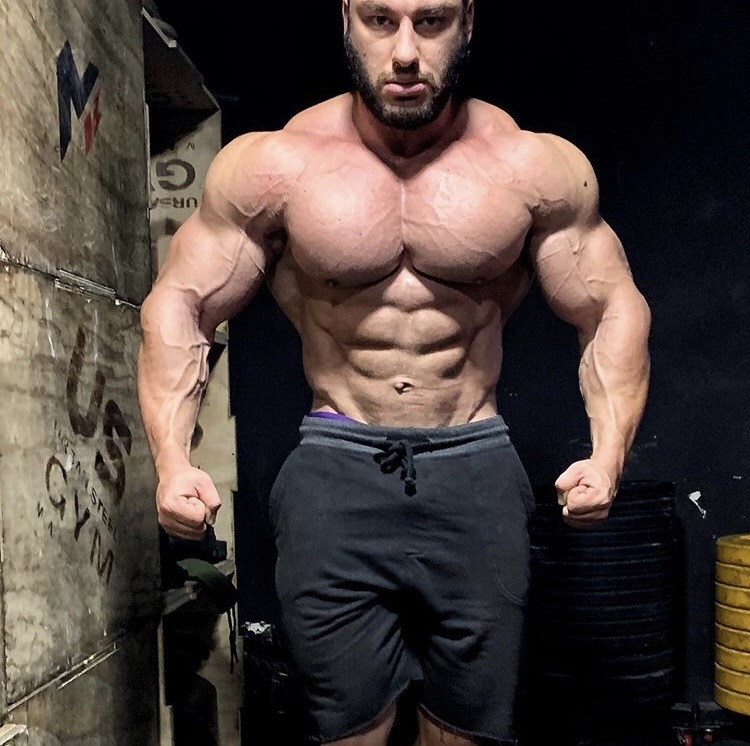 Dan Cristian - His chest and shoulders are at war with his skin and winning. 