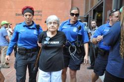 idelity:  Hedy Epstein, a 90-year-old Holocaust survivor, has been taken into custody by police in Ferguson over her protesting and blocking an entrance to the Nixon building.  