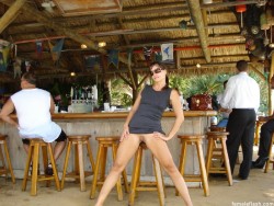 carelessnaked:  In a short dress and showing her pussy in an outdoor bar