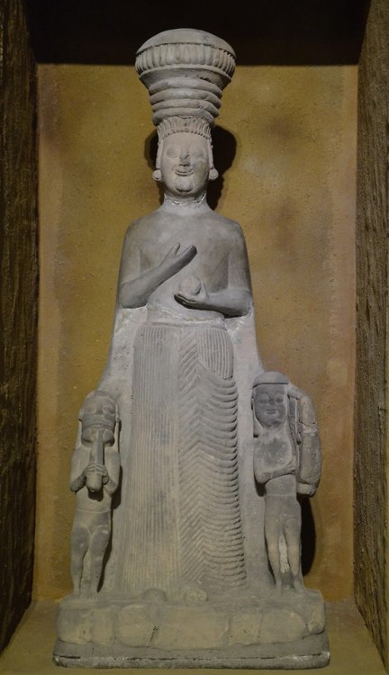 Limestone statue of Cybele, the Phrygian Mother Earth goddess, flanked by two male figures, 6th cent