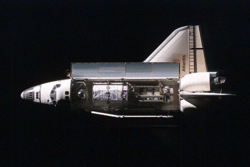 Atlantis approaches the ISS with the P3/P4 truss and solar arrays visible in the cargo bay during ST