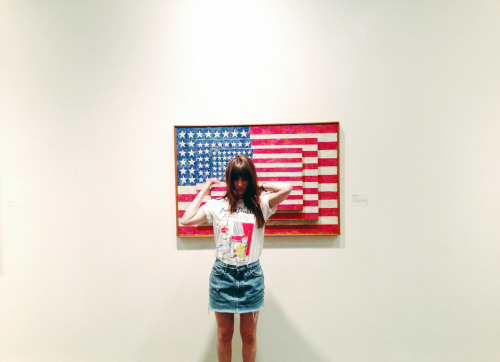 Museum wanderer Amber harmonizing swimmingly with Jasper Johns’ Three Flags in her s