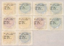 euo:  Jenny Holzer Packaged latex condoms with printed text “Men don’t protect you anymore” 