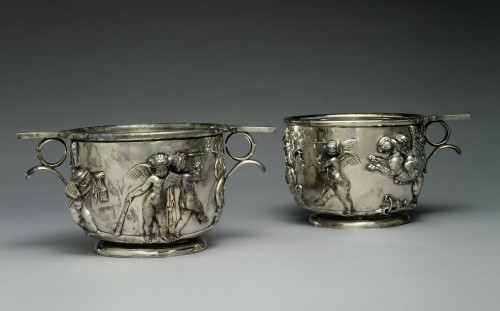 didoofcarthage: Pair of silver scyphi (cups) with decoration of cupids in relief Roman, Early Imperi