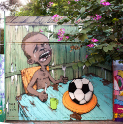  Brazilian Street Artist Has Created the World Cup’s First Viral Image On May 10, Brazilian artist Paulo Ito posted this mural on the doors of a schoolhouse in São Paulo’s Pompeia district. Less than a week later, it has become an international