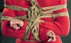 woolbondage:GIrl in woolbondage. Hard ropes over the soft sweater.