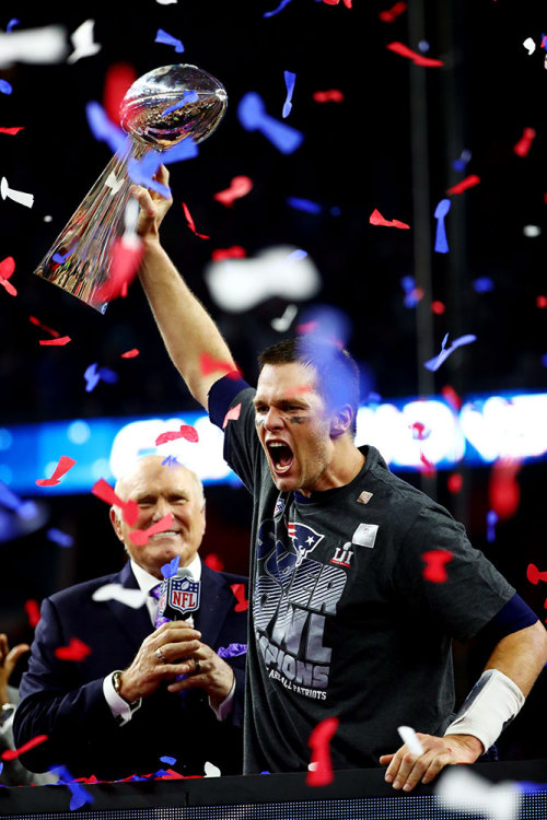 New England Patriots quarterback Tom Brady celebrates with the Vince Lombardi Trophy following his t