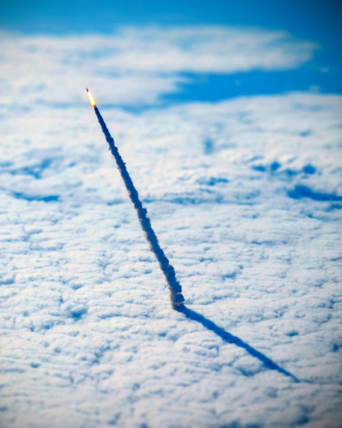 dailyoverview:The space shuttle Endeavour, seen blasting through the clouds during its final launch 