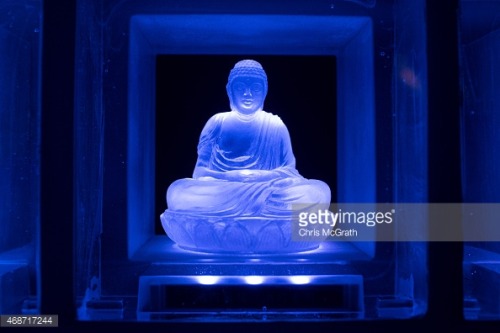 Koukokuji temple head priest Yajima Taijun walks through the Ruriden columbarium as glass Buddha alt