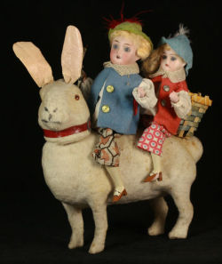 hazedolly: Happy Creepy Victorian Easter from an antique Easter Bunny candy container and two little bisque dolls. Photo source: eBay.com