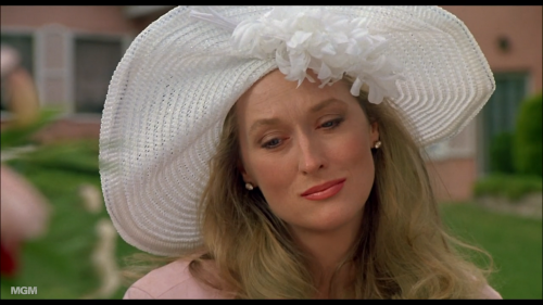 She’s sad because she has to wear that hat. Meryl Streep as Mary Fisher in She-Devil (1989)