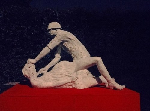 euo: A statue which shows a Soviet soldier raping a pregnant woman as he holds a gun to her head has