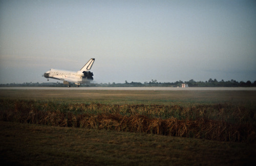 The space shuttle Challenger makes the first landing on the Kennedy Space Center&rsquo;s landing fac