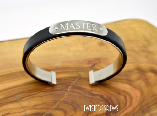 twistedskrews:  Custom engraved:Up to 2 lines20 characters PER LINE (including spaces)This adjustable two layer cuff features Stainless Steel for the bottom layer (against the skin) and black genuine leather as the top layer. Adored with a stainless steel
