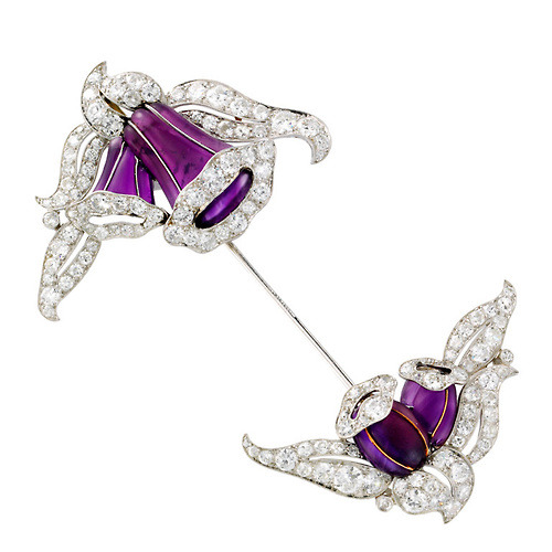 Jabot pin, 1925A jabot pin is a brooch with a bejeweled motif at either end. It is pinned in such a 