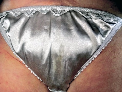 My wife attached this pic of her silver satin panties while texting me at work.  My concentration to