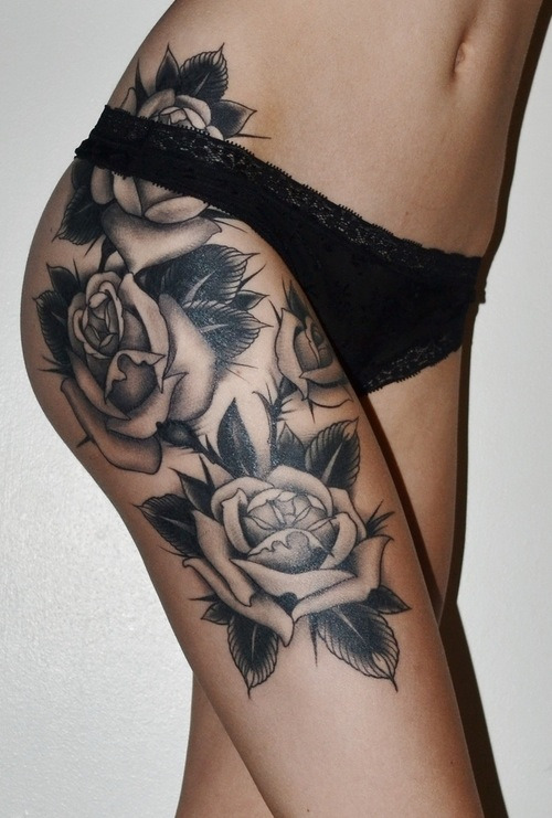 Flower skull thigh tattoo